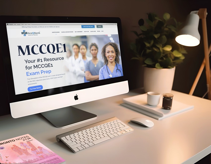 A computer screen displays a webpage for MCCQE1 exam preparation with a group of medical professionals, specifically highlighting Ace QBank. The desk has a keyboard, mouse, lamp, plant, and a magazine in the foreground.