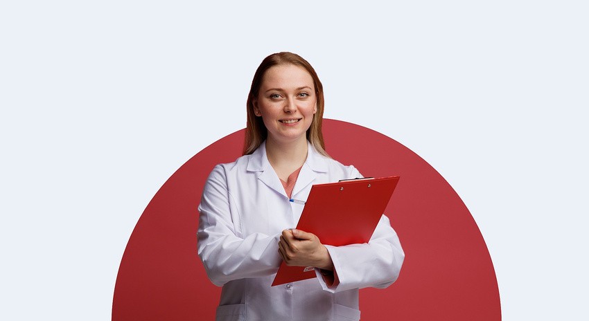 A woman in a white lab coat holds a red clipboard and smiles, standing in front of a red circular background, ready to assist with MCCQE1 exam preparation.