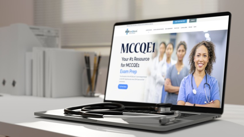 A laptop is open on a desk with a stethoscope placed nearby. The screen displays a website for MCCQE1 exam preparation, featuring an image of medical professionals in the header and the words "Avoid Procrastination to Boost MCCQE1 Prep.