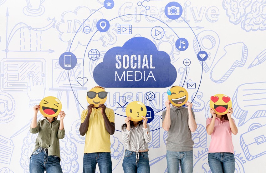 Five people holding emoji faces stand in front of a social media-themed wall, ready to conquer the MCCQE1. They're determined to follow Canadian guidelines and utilize resources like Ace QBank for their preparation.